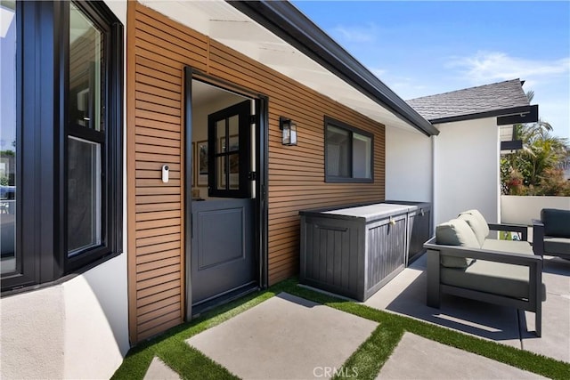 2343 E Athens Ave, Orange, CA 92867 - view of exterior entry with a patio, stucco siding, and an outdoor living space
