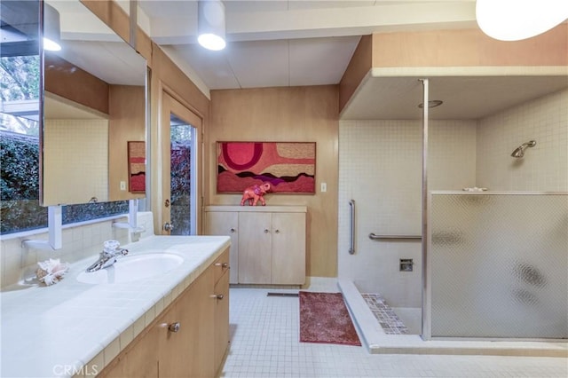 5646 E Park Circle Dr, Fresno, CA 93727 - bathroom with a shower stall, vanity, tile patterned flooring, and healthy amount of natural light