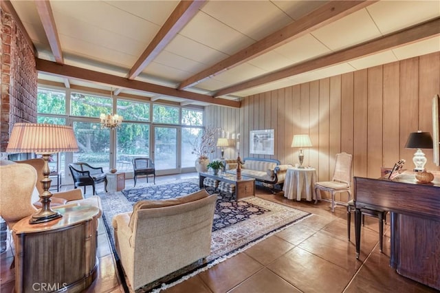 5646 E Park Circle Dr, Fresno, CA 93727 - tiled living room featuring beam ceiling, wood walls, and a chandelier