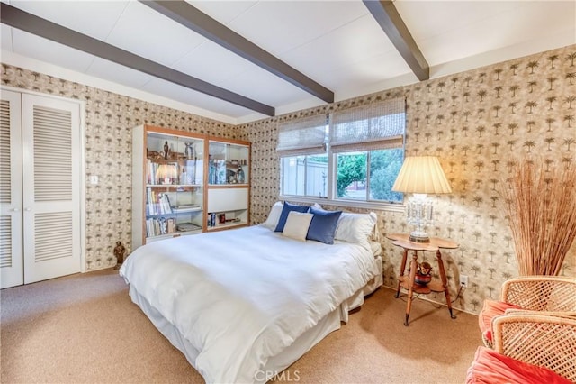 5646 E Park Circle Dr, Fresno, CA 93727 - bedroom featuring wallpapered walls, beam ceiling, and carpet