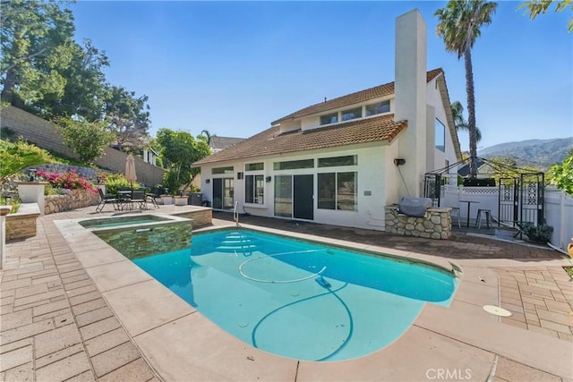 3381 Deaver Dr, Corona, CA 92882 - view of swimming pool with a gazebo, fence, a patio, area for grilling, and a pool with connected hot tub