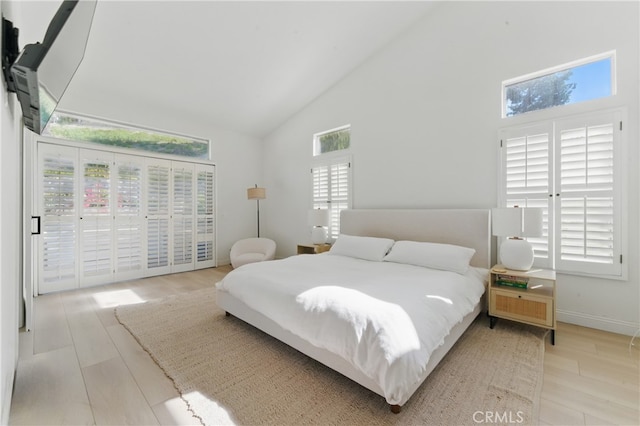 3381 Deaver Dr, Corona, CA 92882 - bedroom featuring high vaulted ceiling, wood finished floors, and access to exterior