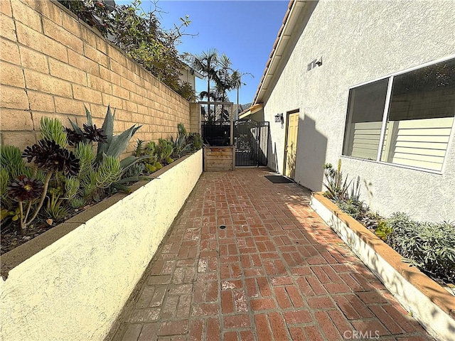 3381 Deaver Dr, Corona, CA 92882 - view of property exterior featuring fence, a gate, and stucco siding