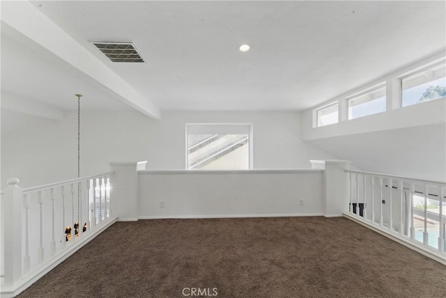 3381 Deaver Dr, Corona, CA 92882 - spare room with baseboards, beam ceiling, visible vents, and carpet