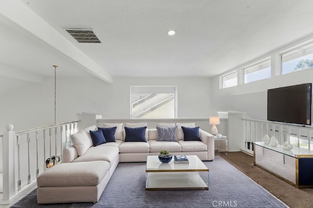 3381 Deaver Dr, Corona, CA 92882 - carpeted living area featuring beamed ceiling and visible vents