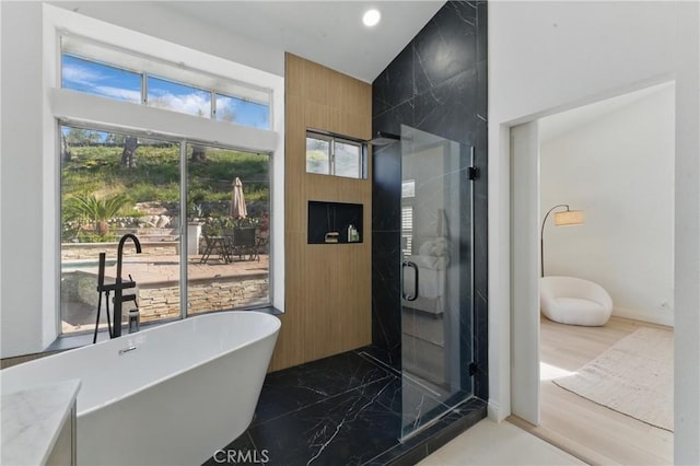3381 Deaver Dr, Corona, CA 92882 - full bathroom with recessed lighting, a soaking tub, a wealth of natural light, and a stall shower
