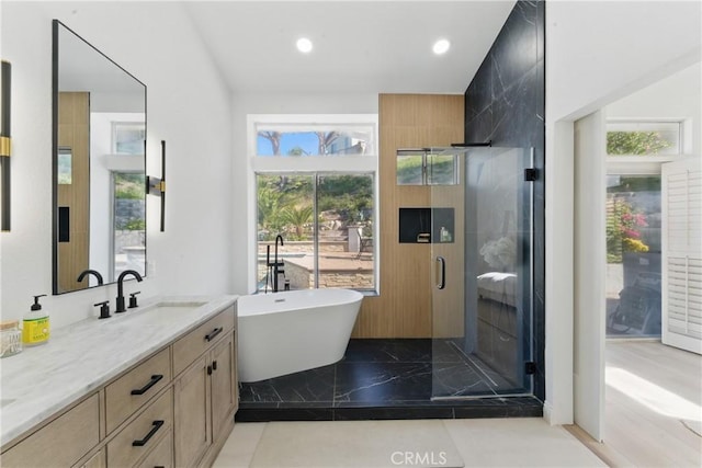 3381 Deaver Dr, Corona, CA 92882 - bathroom featuring a shower stall, a freestanding tub, vanity, marble finish floor, and recessed lighting
