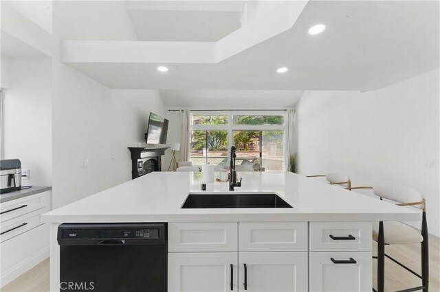 3381 Deaver Dr, Corona, CA 92882 - kitchen with white cabinets, light countertops, a sink, recessed lighting, and dishwasher