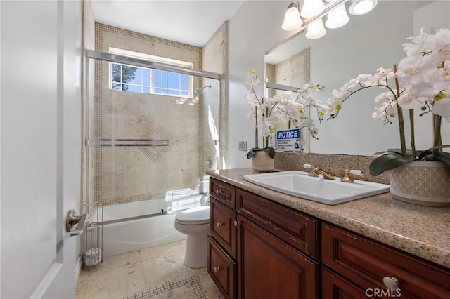 11310 Wentworth St, Sun Valley, CA 91352 - bathroom with a chandelier, toilet, vanity, and bath / shower combo with glass door