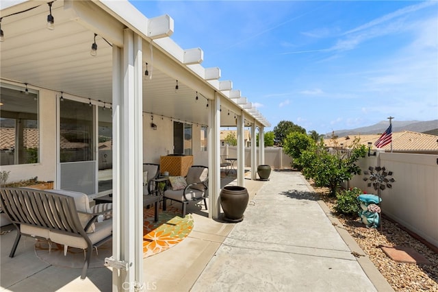 6112 Turnberry Dr, Banning, CA 92220 - view of patio / terrace with a mountain view and a fenced backyard