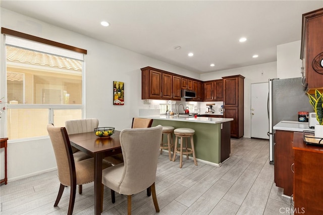 6112 Turnberry Dr, Banning, CA 92220 - dining area with recessed lighting and light wood finished floors