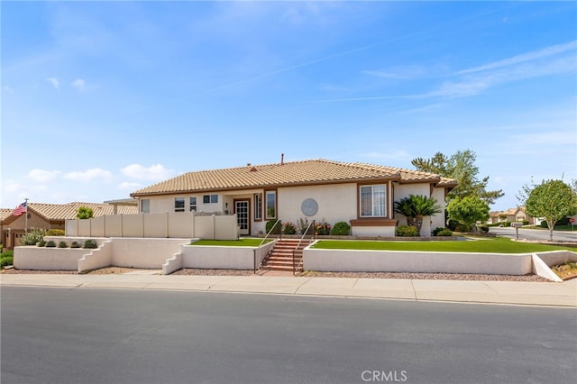 6112 Turnberry Dr, Banning, CA 92220 - view of front of house featuring stucco siding, fence, and a tiled roof