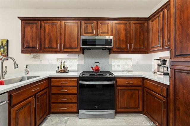 6112 Turnberry Dr, Banning, CA 92220 - kitchen with light countertops, a sink, and stainless steel appliances