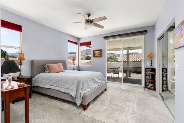 6112 Turnberry Dr, Banning, CA 92220 - carpeted bedroom with access to outside and ceiling fan