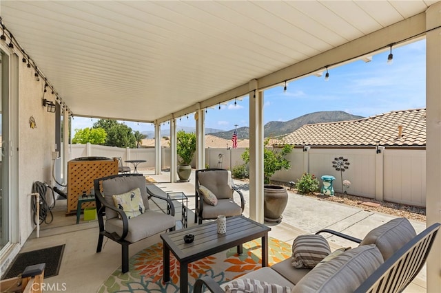 6112 Turnberry Dr, Banning, CA 92220 - view of patio / terrace featuring an outdoor living space, a fenced backyard, and a mountain view