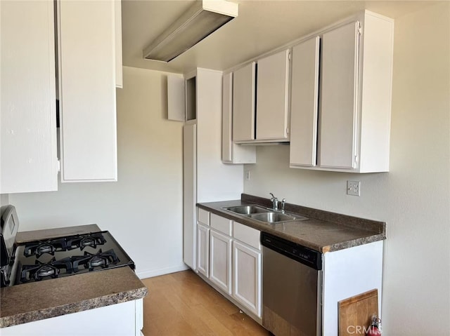 1566 Pine Ave Unit 206A, Long Beach, CA 90813 - kitchen featuring stainless steel dishwasher, light wood-type flooring, dark countertops, black gas stove, and white cabinets