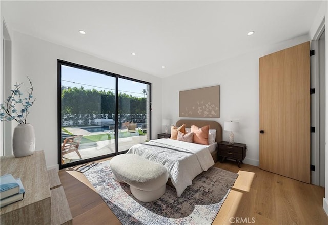 bedroom with light wood-type flooring, baseboards, access to outside, and recessed lighting