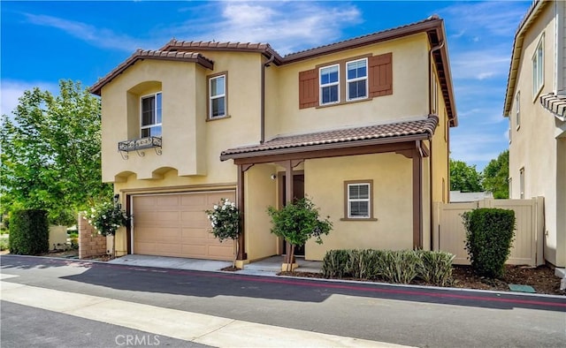 23206 W Remington Way, West Hills, CA 91307 - mediterranean / spanish-style home with a garage, a tile roof, stucco siding, and fence