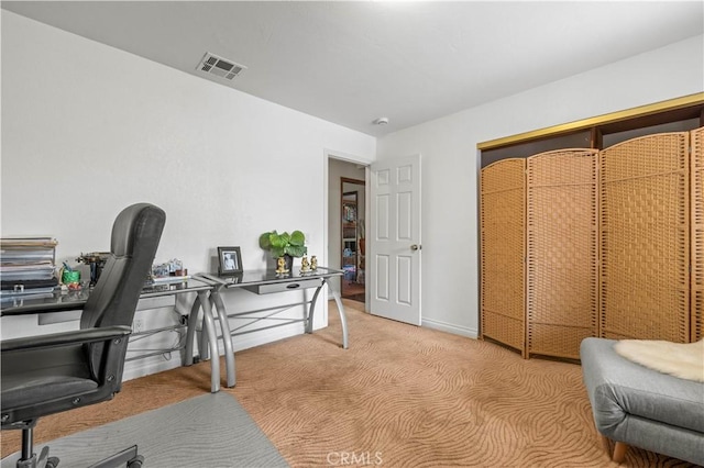 home office featuring visible vents and carpet floors