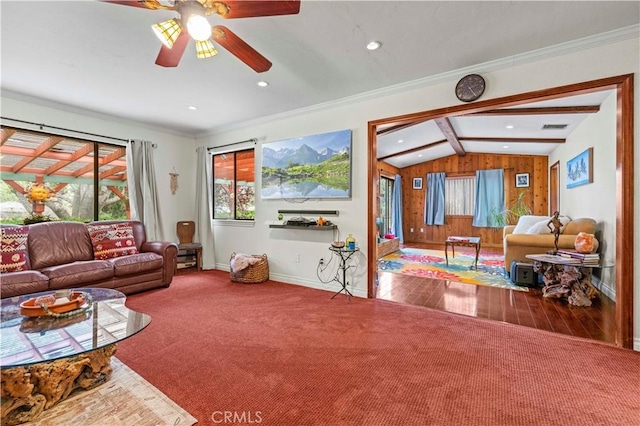 carpeted living area featuring a healthy amount of sunlight, baseboards, vaulted ceiling with beams, and recessed lighting