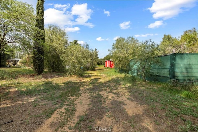 view of yard with an outdoor structure