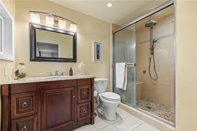 bathroom with tile patterned flooring, vanity, toilet, recessed lighting, and a shower stall