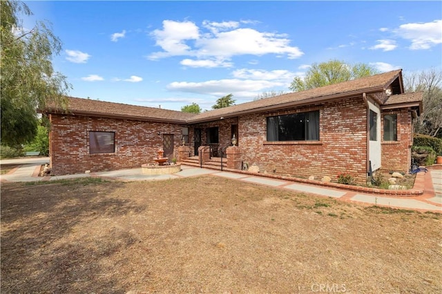 view of front of property featuring brick siding