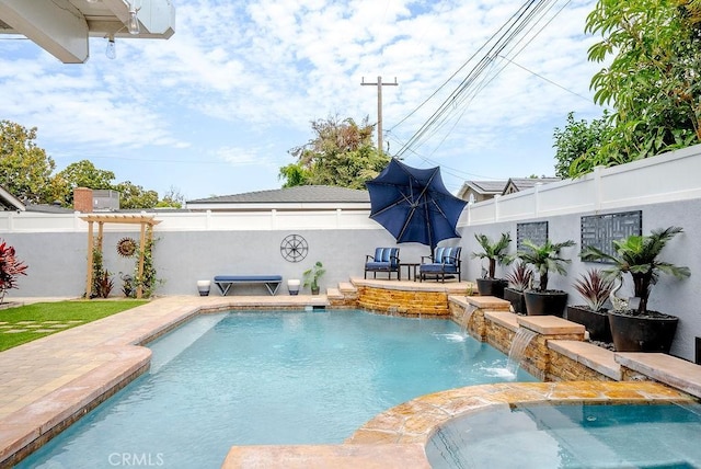 view of swimming pool with a patio, a fenced in pool, a jacuzzi, and a fenced backyard