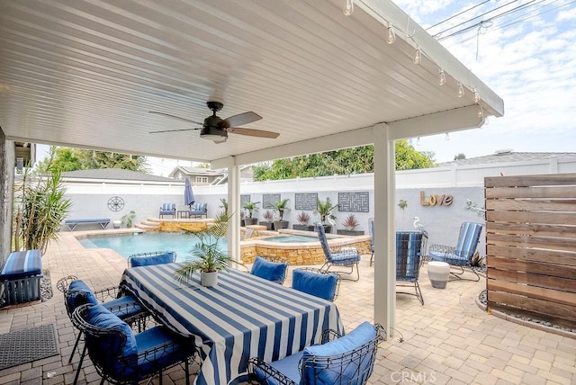 view of patio featuring outdoor dining space, a fenced backyard, a fenced in pool, an in ground hot tub, and a ceiling fan