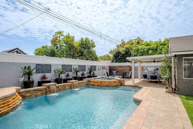 view of swimming pool with a fenced backyard, a patio area, and a pool with connected hot tub