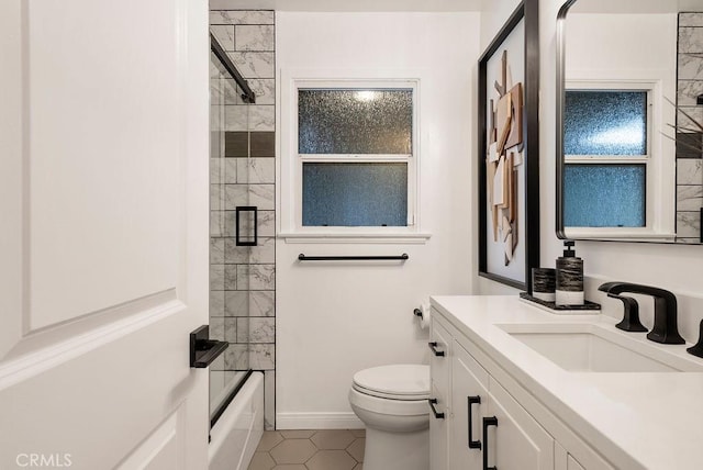 full bath with vanity,  shower combination, tile patterned floors, and toilet