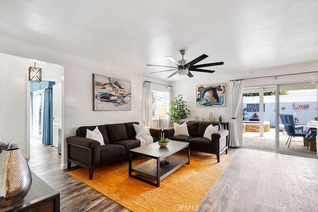 living room with ceiling fan and wood finished floors