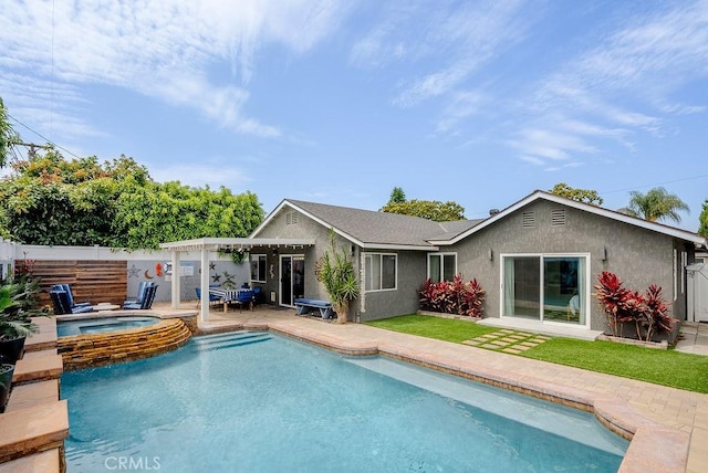 back of property featuring a fenced in pool, an in ground hot tub, a patio area, and stucco siding