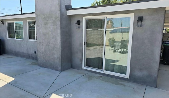 2108 Raleigh Ave, Costa Mesa, CA 92627 - view of exterior entry featuring a patio area and stucco siding