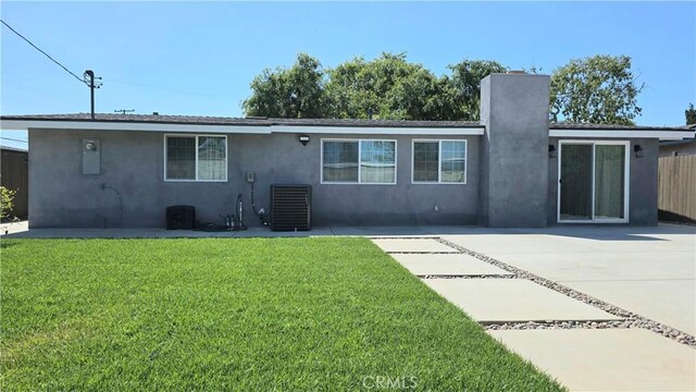 2108 Raleigh Ave, Costa Mesa, CA 92627 - rear view of property with stucco siding, a chimney, central AC unit, and a patio area