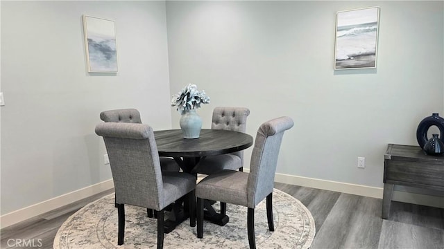 2108 Raleigh Ave, Costa Mesa, CA 92627 - dining area with baseboards and wood finished floors