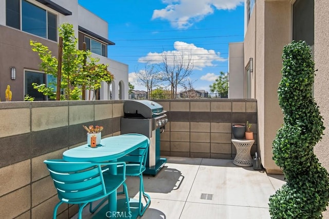view of patio featuring a grill