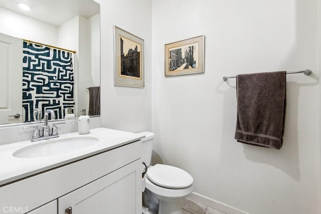 bathroom featuring tile patterned flooring, toilet, vanity, and a shower with shower curtain