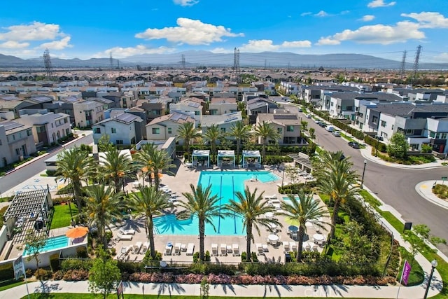 3630 E Peckham Paseo Unit 4, Ontario, CA 91761 - aerial view of residential area with a pool and mountains