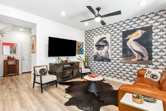 living room with recessed lighting, wood finished floors, and a ceiling fan