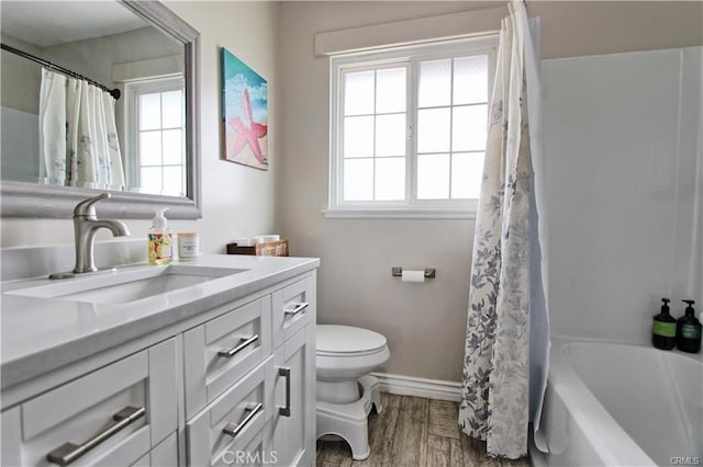8037 Cactus Cir, Buena Park, CA 90620 - bathroom featuring healthy amount of natural light, toilet, baseboards, and wood finished floors