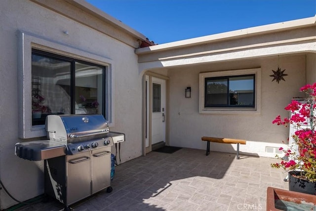 view of patio with a grill