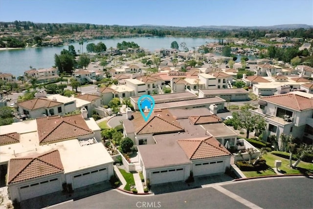 birds eye view of property featuring a residential view and a water view