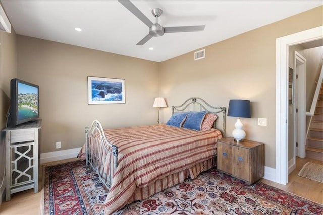 bedroom featuring recessed lighting, wood finished floors, visible vents, a ceiling fan, and baseboards