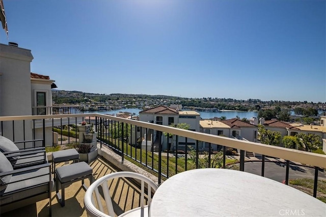 balcony featuring a water view