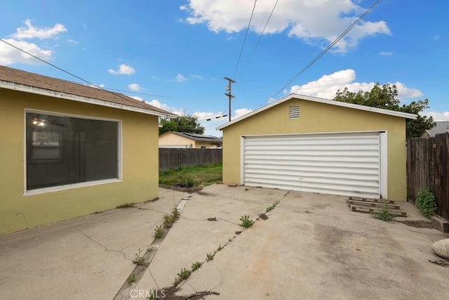 detached garage with fence
