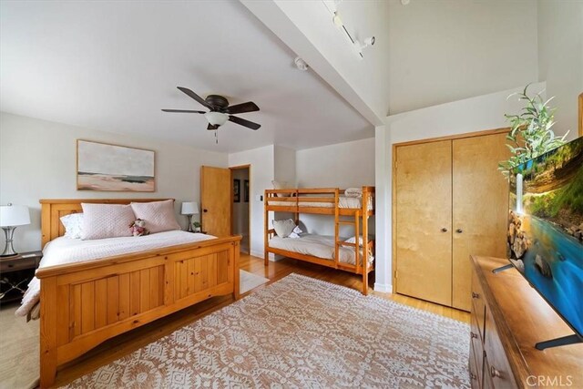 bedroom featuring a ceiling fan and wood finished floors