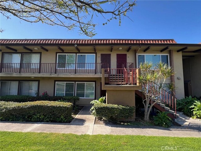 1400 W Warner Ave Unit 60, Santa Ana, CA 92704 - view of front of home featuring stairs and stucco siding
