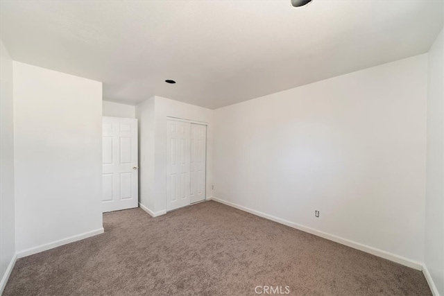 63285 Pinyon Dr, Mountain Center, CA 92561 - unfurnished bedroom with carpet floors, baseboards, and a closet