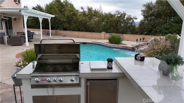 1732 Gamble Ln, Escondido, CA 92029 - view of pool with exterior kitchen, a fenced backyard, and a patio area